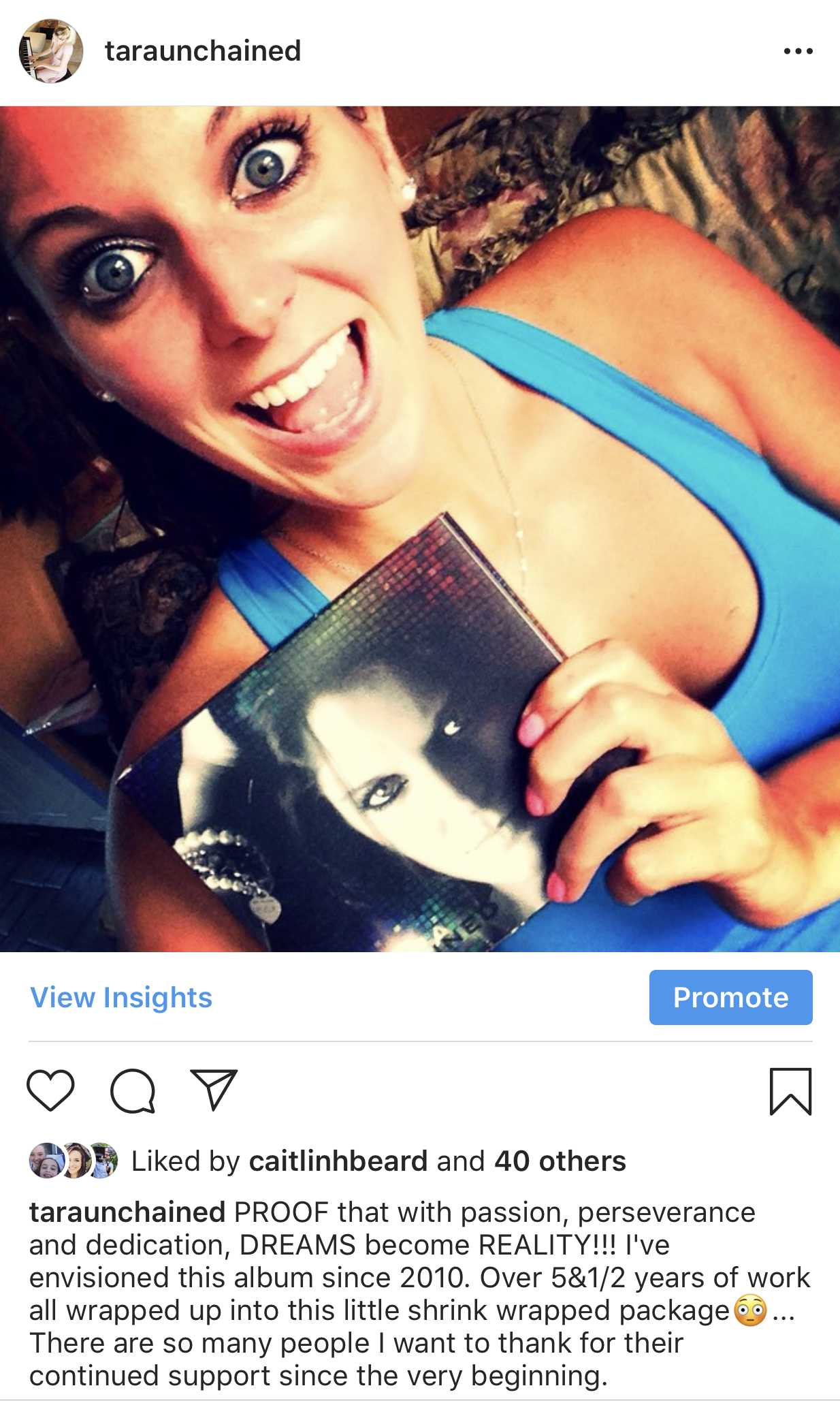 Tara holding her second album cover, giving thanks to her passion and commitment to becoming a piano influencer