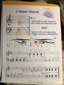 A student's lyrics shown on the C Major Chord Free Piano Worksheet 