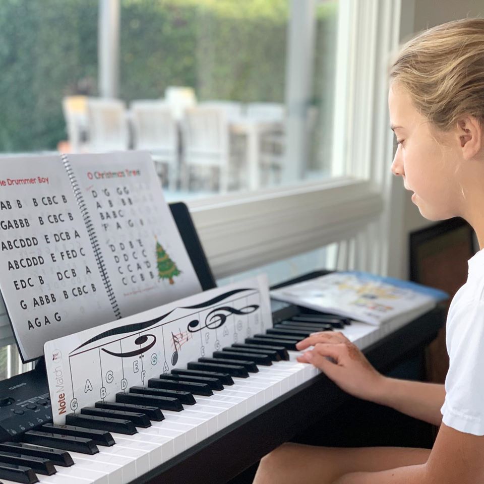 Student using NoteMatch to play the piano