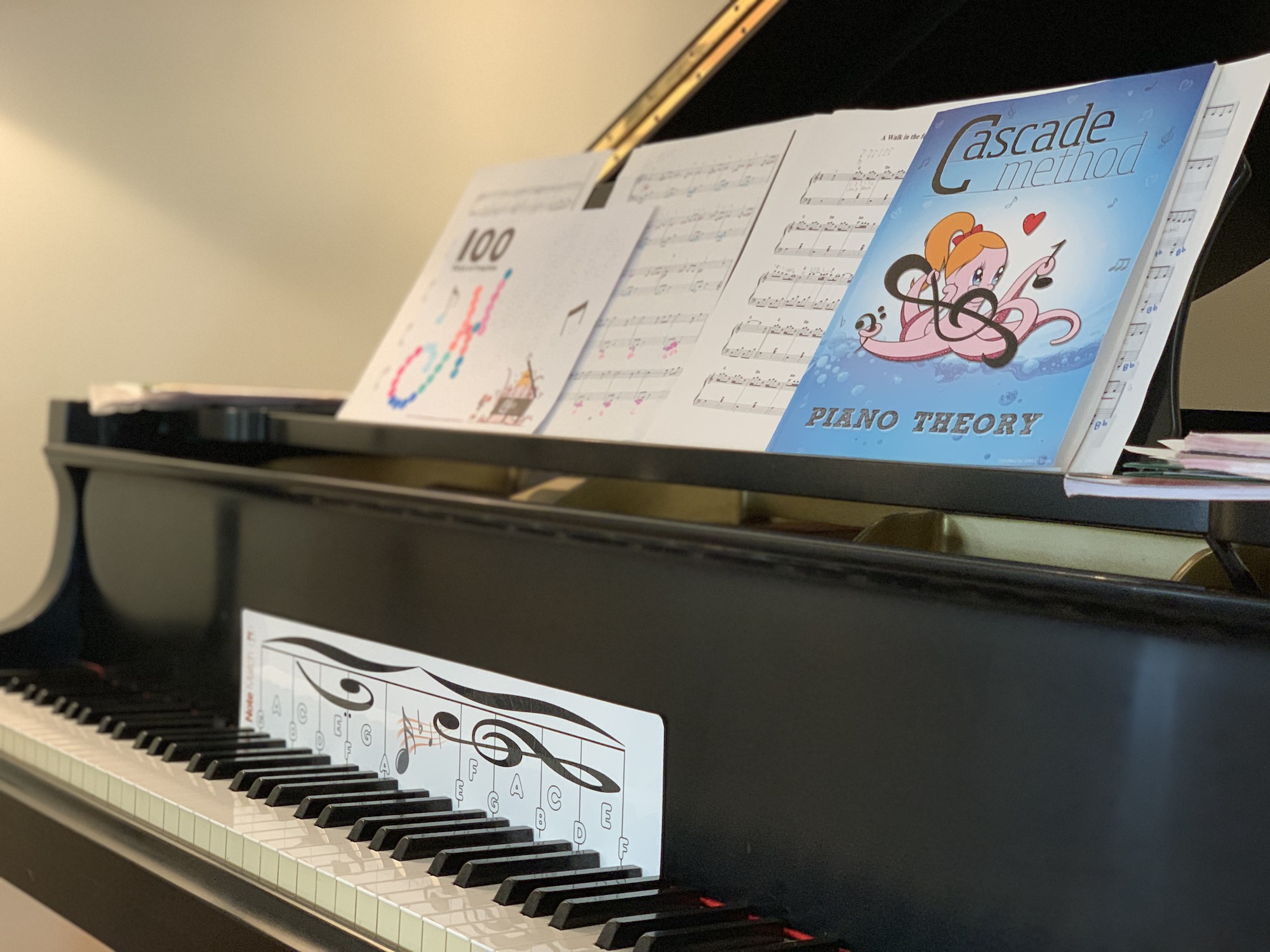 Grand piano showcasing Notematch and The Cascade Method Book Collection