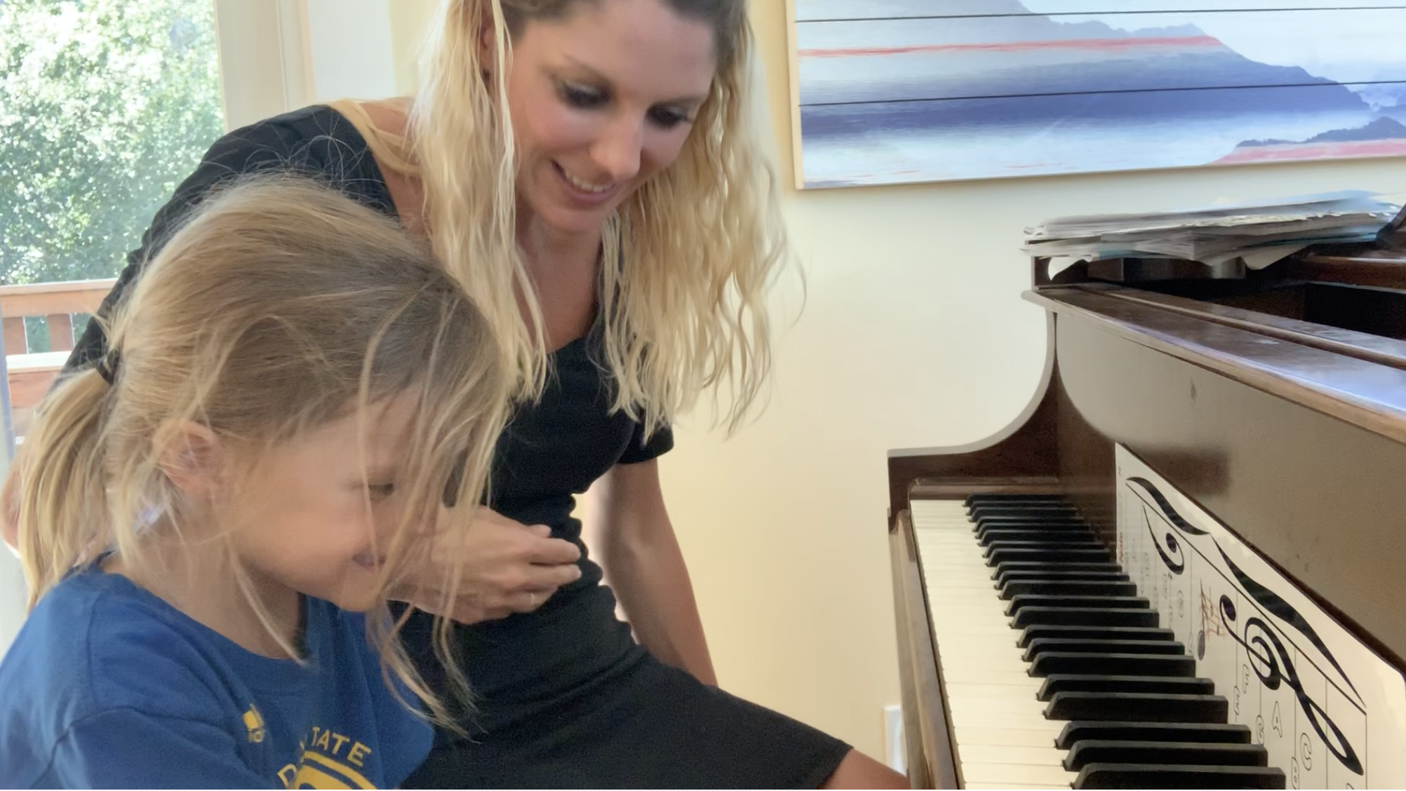 Tara, Founder of The Cascade Method Training Program, teaching a student piano 