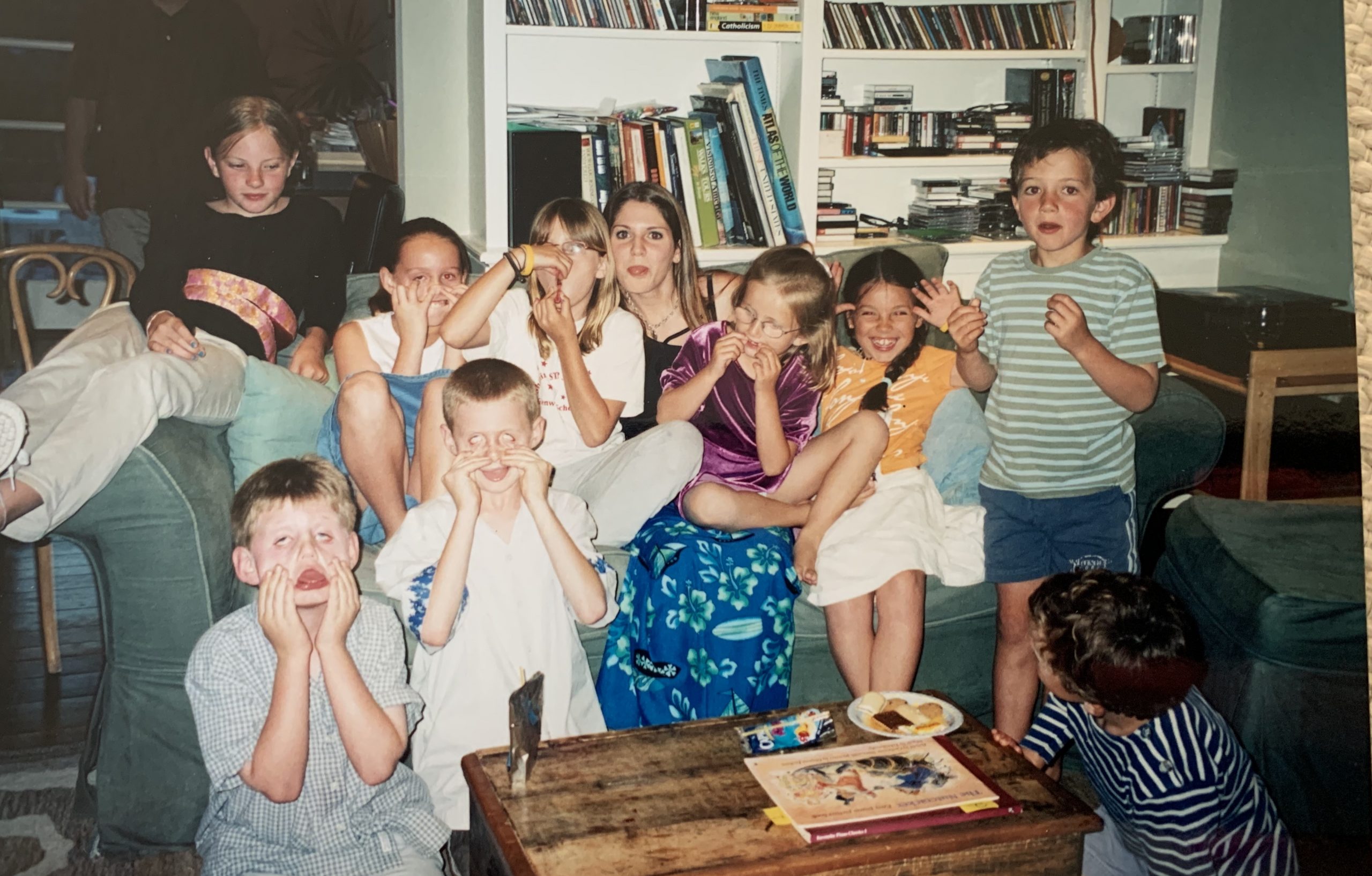 Tara with all her piano students making funny faces 