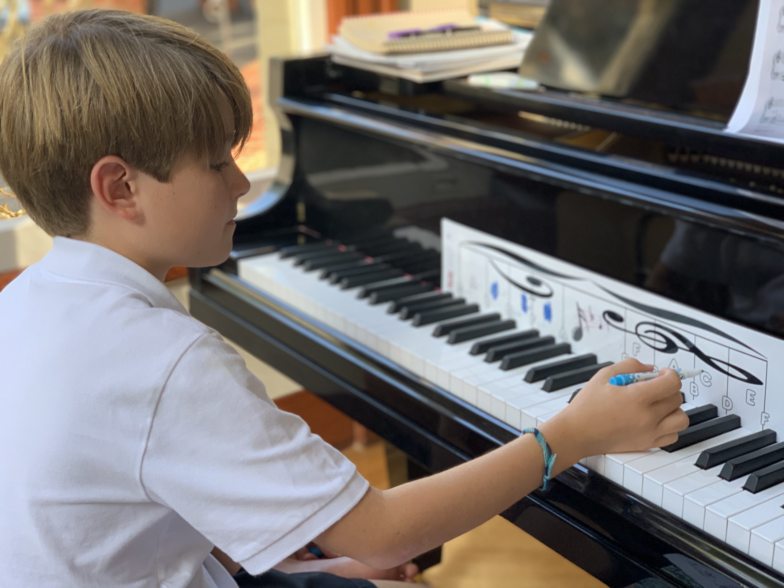 Student using notematch to learn the chords on the piano 
