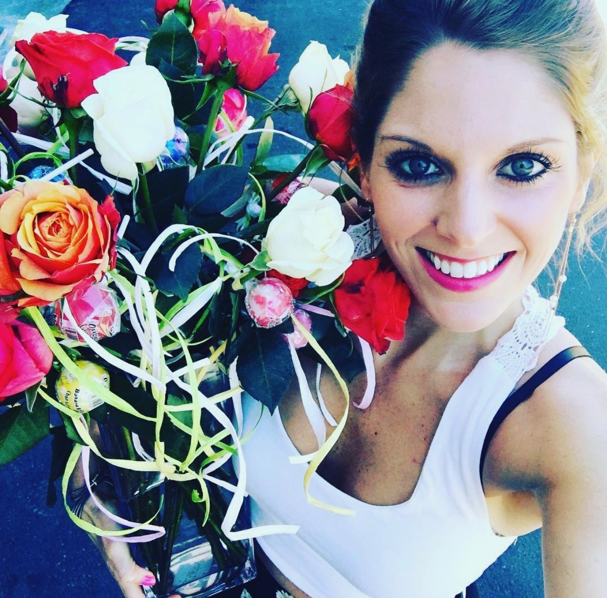 Tara holding roses for her student piano recital