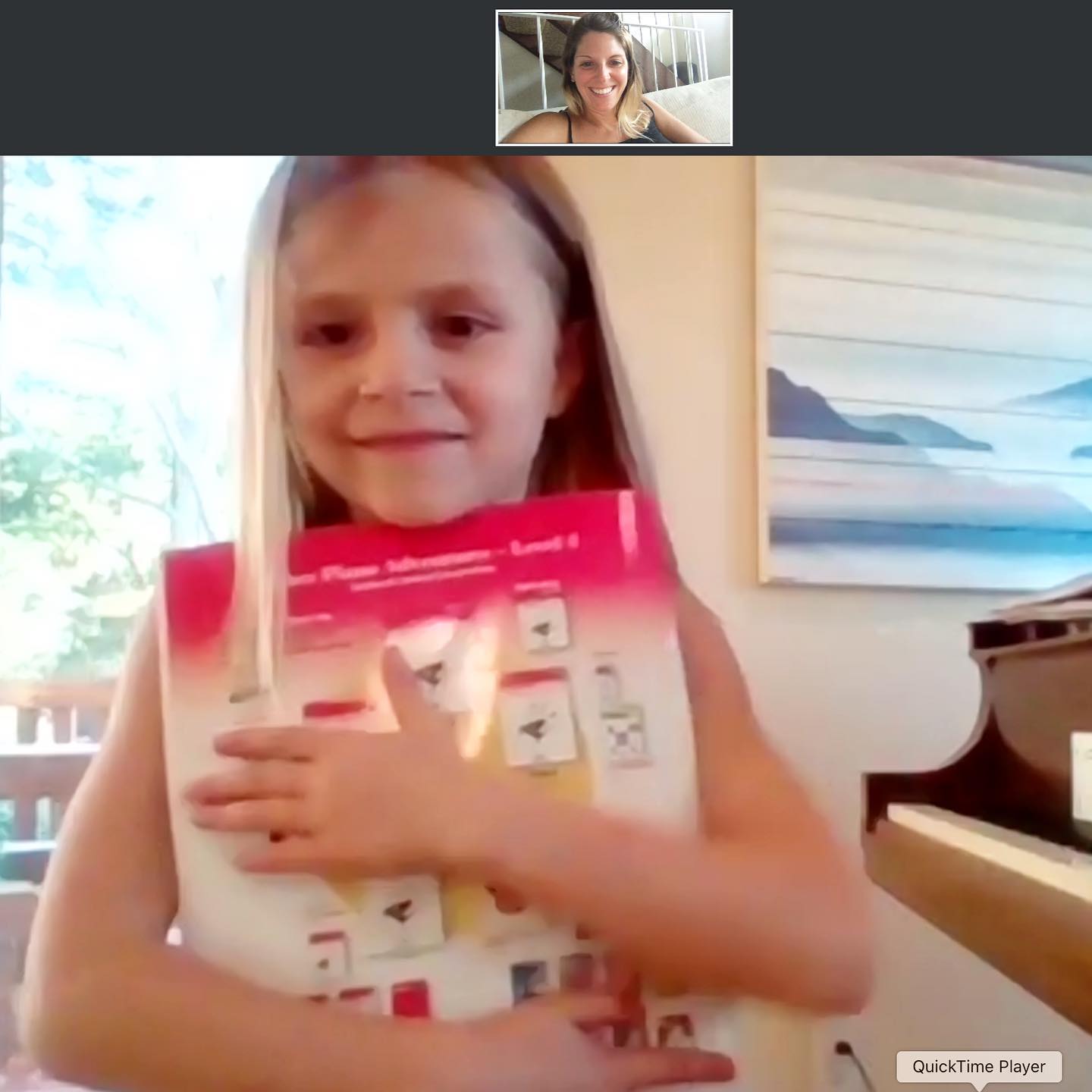 Teagan on Facetime with Tara for virtual piano lessons