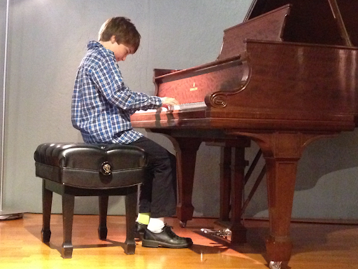 Young Jonah playing at a recital 